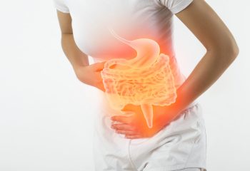 Woman touching stomach