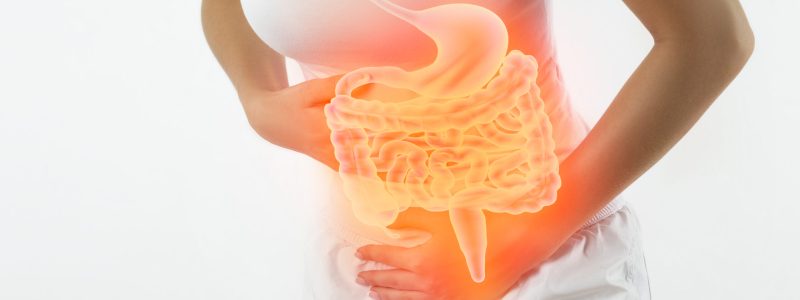 Woman touching stomach